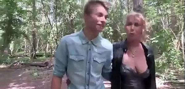  Young guy fucks an adult lady with beautiful boobs right in the forest